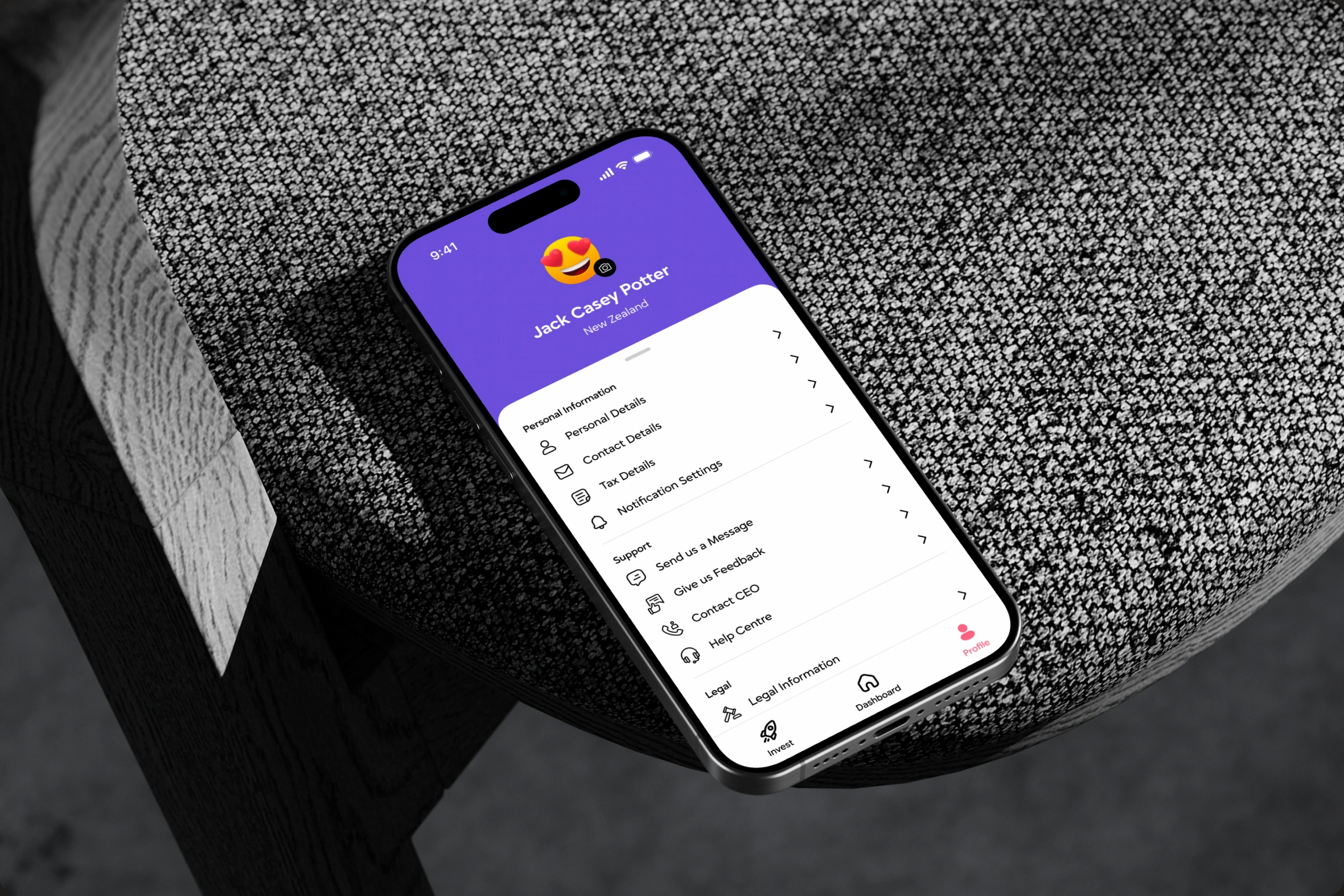 AVVO profile screen on a phone resting on textured grey rock