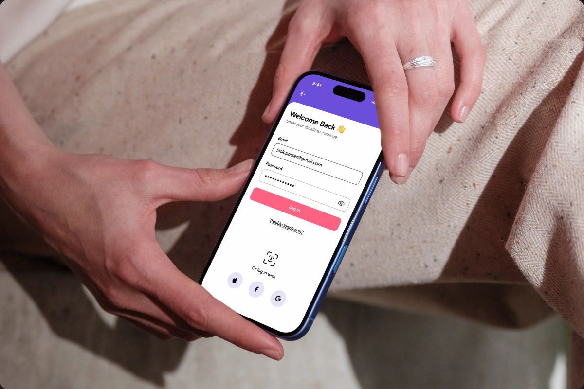 A woman checking the AVVO investment app on her phone